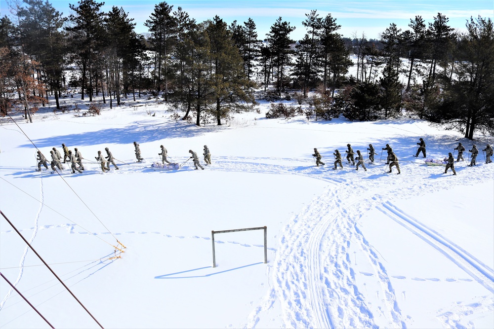 Fort McCoy CWOC class 21-04 students conduct field training in snowshoes, pulling sleds