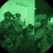Team of Brazilian Paratroopers prepare to breach corner of building during night operations at JRTC 21-04