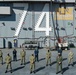 Sailors pose for a photo on the flight deck