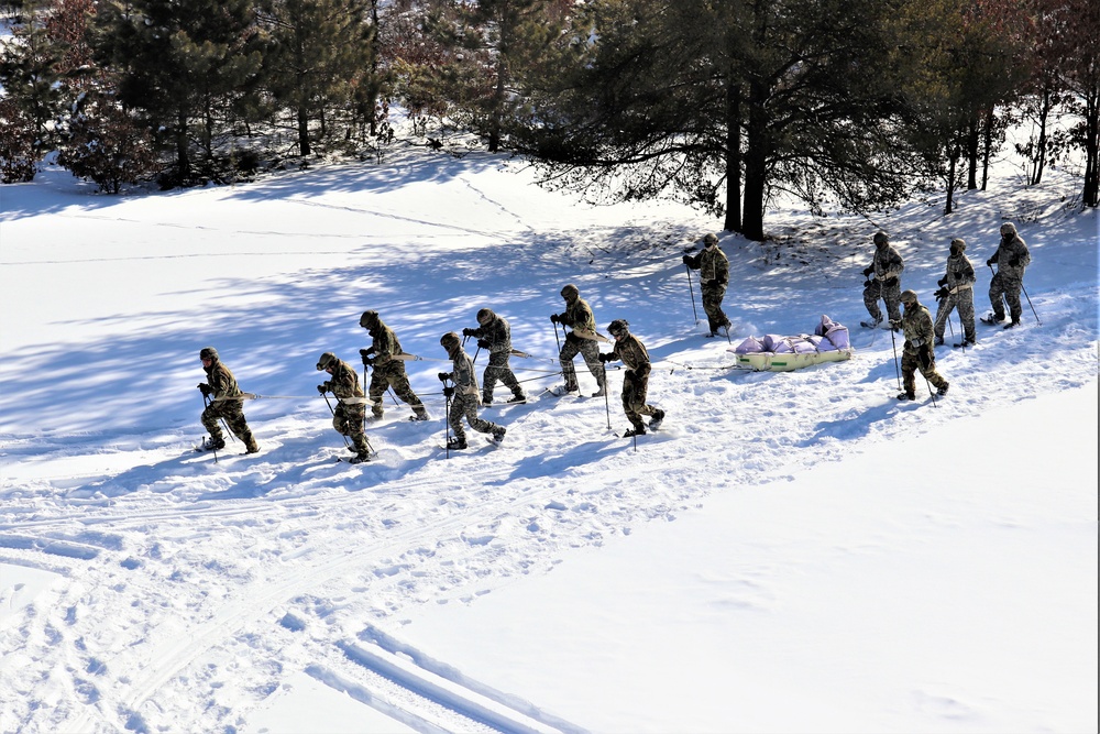 Fort McCoy CWOC class 21-04 students conduct field training in snowshoes, pulling sleds