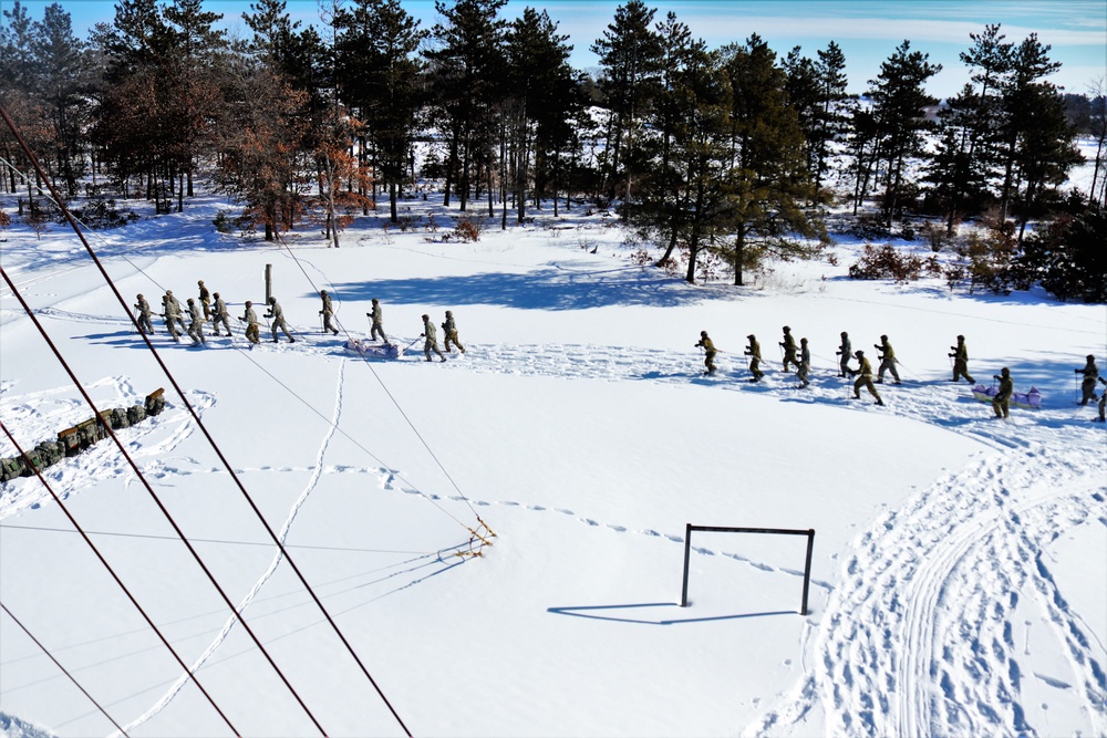 Fort McCoy CWOC class 21-04 students conduct field training in snowshoes, pulling sleds