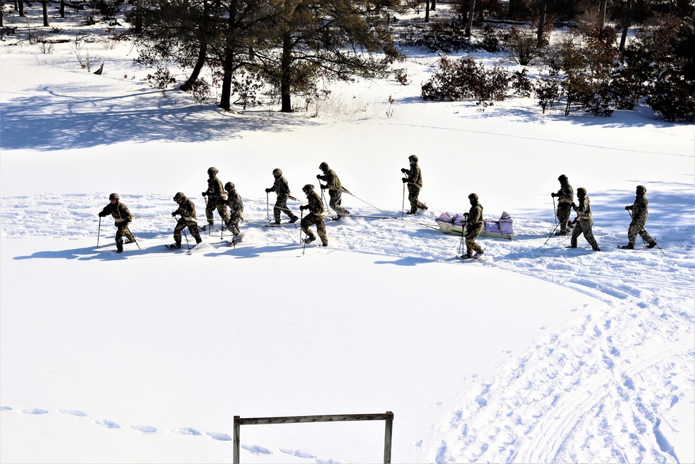 Fort McCoy CWOC class 21-04 students conduct field training in snowshoes, pulling sleds