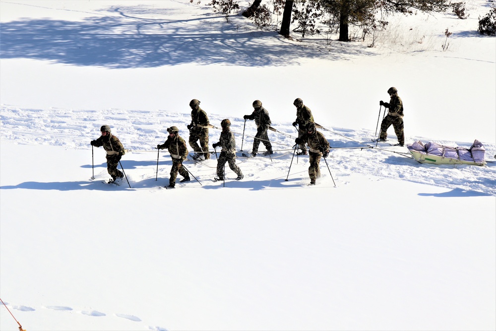 Fort McCoy CWOC class 21-04 students conduct field training in snowshoes, pulling sleds