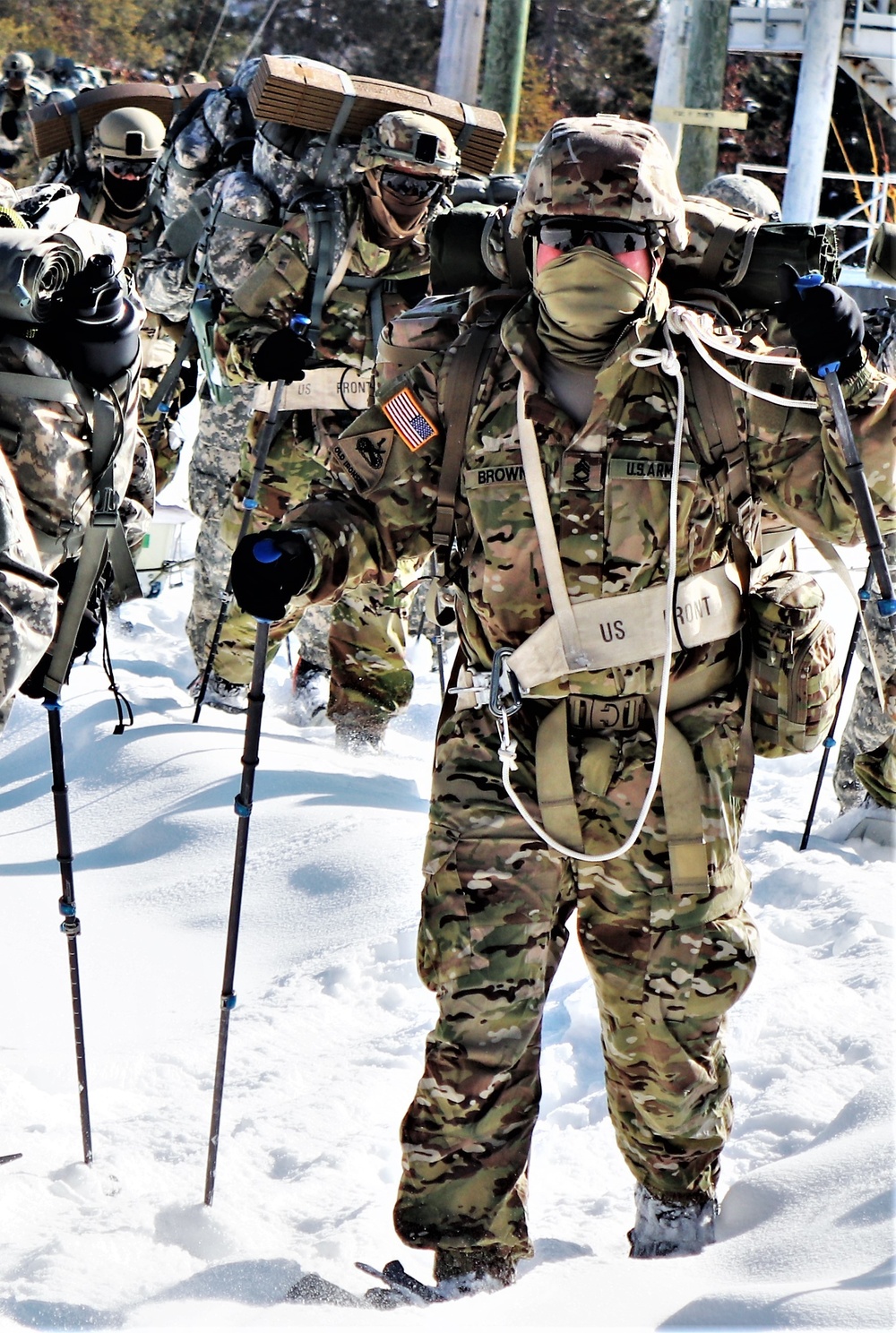 Cold-Weather Operations Course class 21-04 students conduct field training in snowshoes, pulling sleds