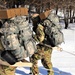 Cold-Weather Operations Course class 21-04 students conduct field training in snowshoes, pulling sleds
