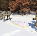 Cold-Weather Operations Course class 21-04 students conduct field training in snowshoes, pulling sleds