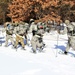 Cold-Weather Operations Course class 21-04 students conduct field training in snowshoes, pulling sleds