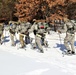 Cold-Weather Operations Course class 21-04 students conduct field training in snowshoes, pulling sleds