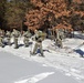 Cold-Weather Operations Course class 21-04 students conduct field training in snowshoes, pulling sleds