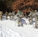 Cold-Weather Operations Course class 21-04 students conduct field training in snowshoes, pulling sleds