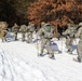 Cold-Weather Operations Course class 21-04 students conduct field training in snowshoes, pulling sleds