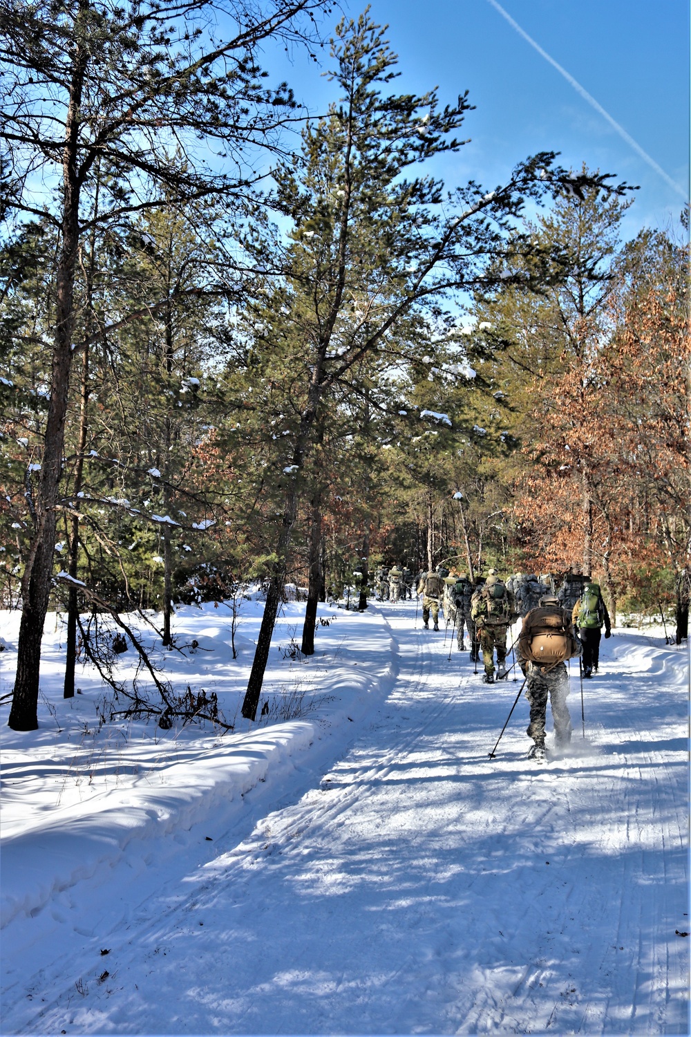 Cold-Weather Operations Course class 21-04 students conduct field training in snowshoes, pulling sleds