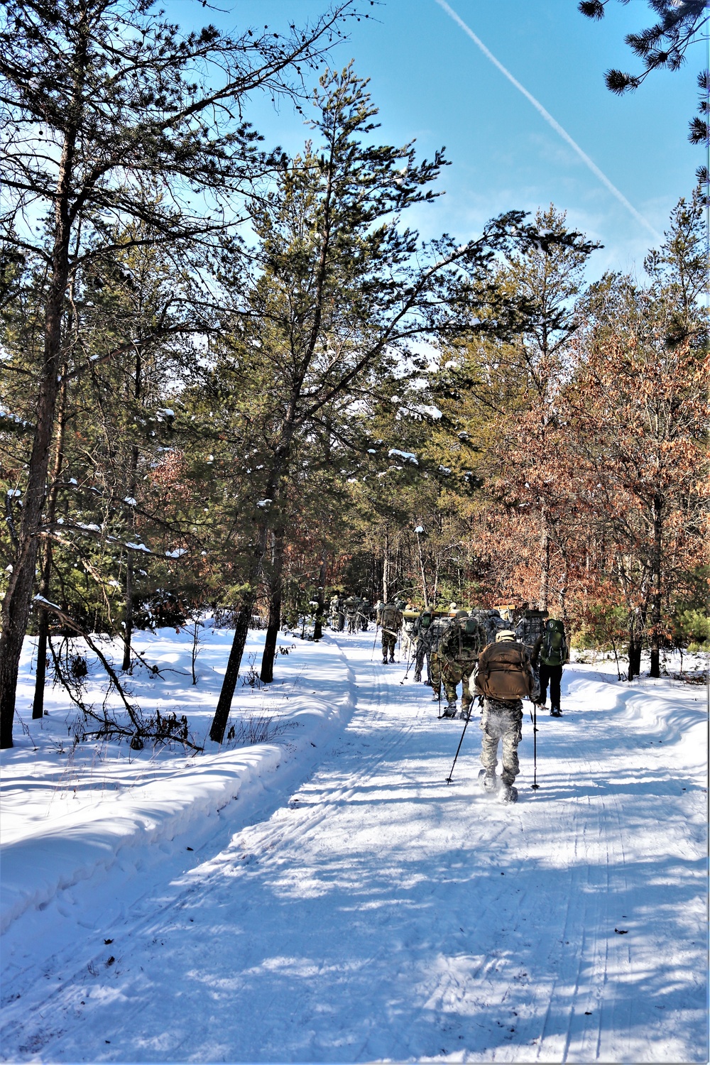 Cold-Weather Operations Course class 21-04 students conduct field training in snowshoes, pulling sleds