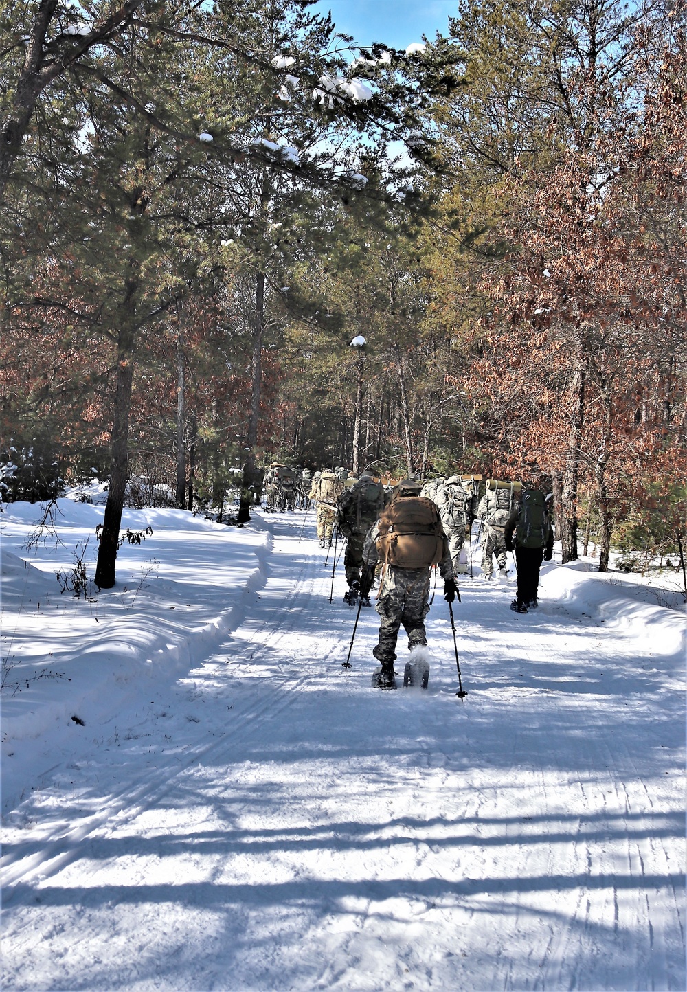 Cold-Weather Operations Course class 21-04 students conduct field training in snowshoes, pulling sleds