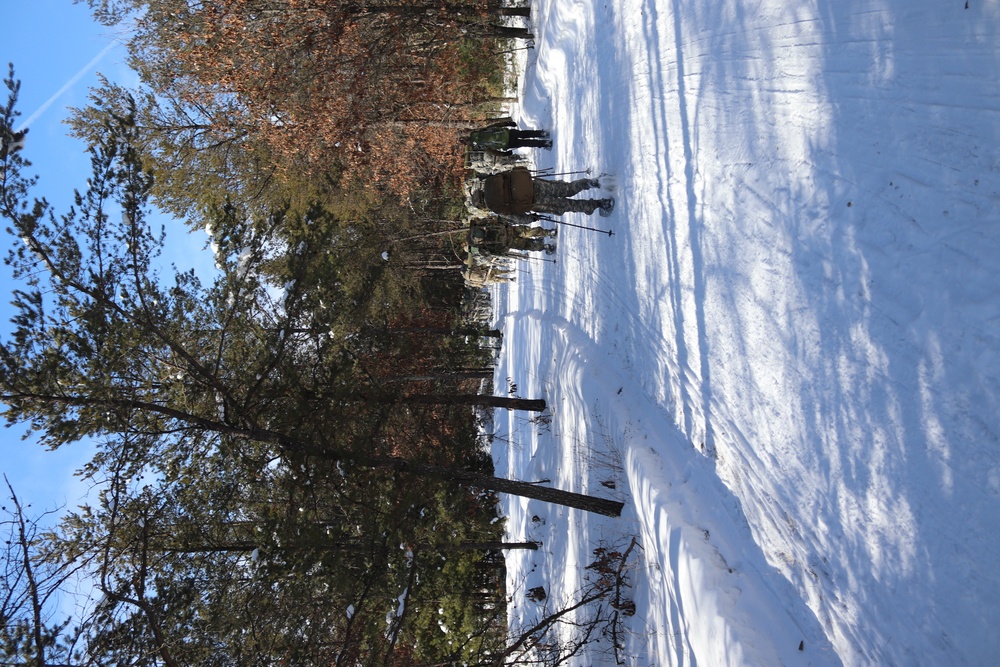Cold-Weather Operations Course class 21-04 students conduct field training in snowshoes, pulling sleds