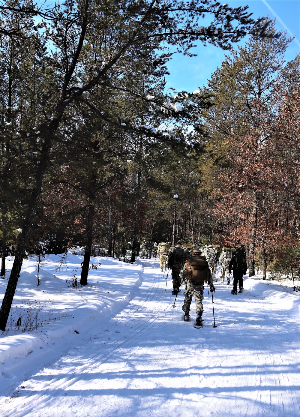 Cold-Weather Operations Course class 21-04 students conduct field training in snowshoes, pulling sleds