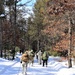 Cold-Weather Operations Course class 21-04 students conduct field training in snowshoes, pulling sleds