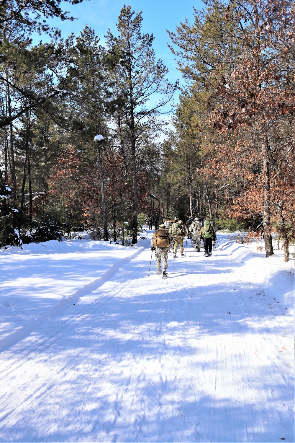 Cold-Weather Operations Course class 21-04 students conduct field training in snowshoes, pulling sleds