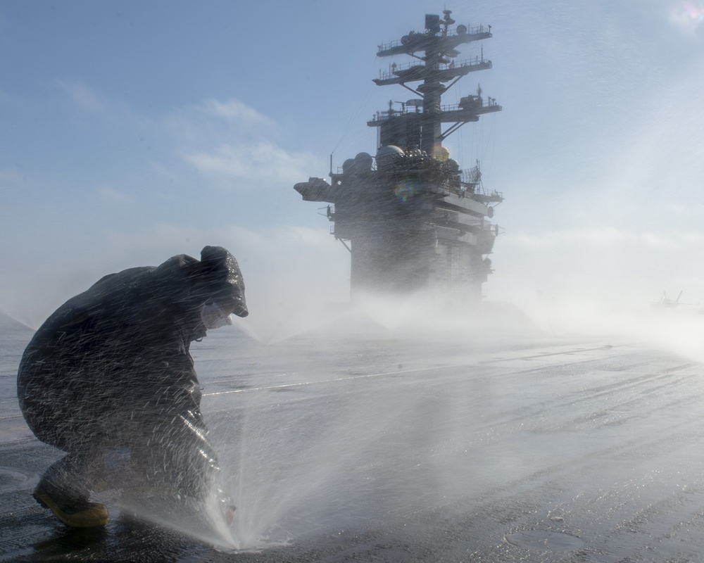 Sailor Participates in Counter-Measure Washdown