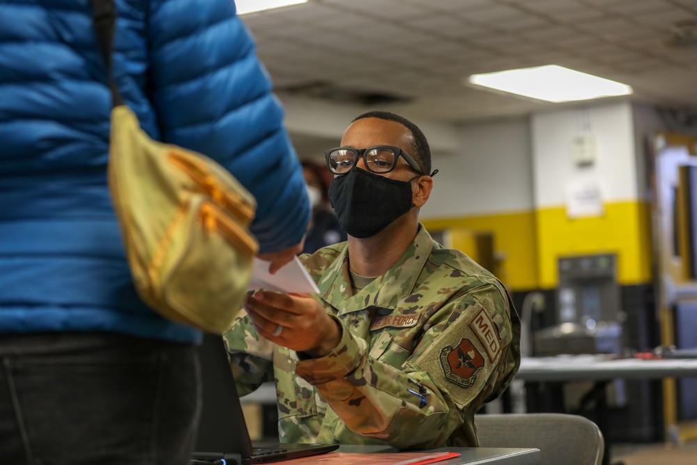 U.S. Air Force Airmen provide support on the opening day at the Medgar Evers College COVID-19 Community Vaccination Center