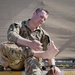 Deployed Soldier Inspects Feet After Norwegian Foot March