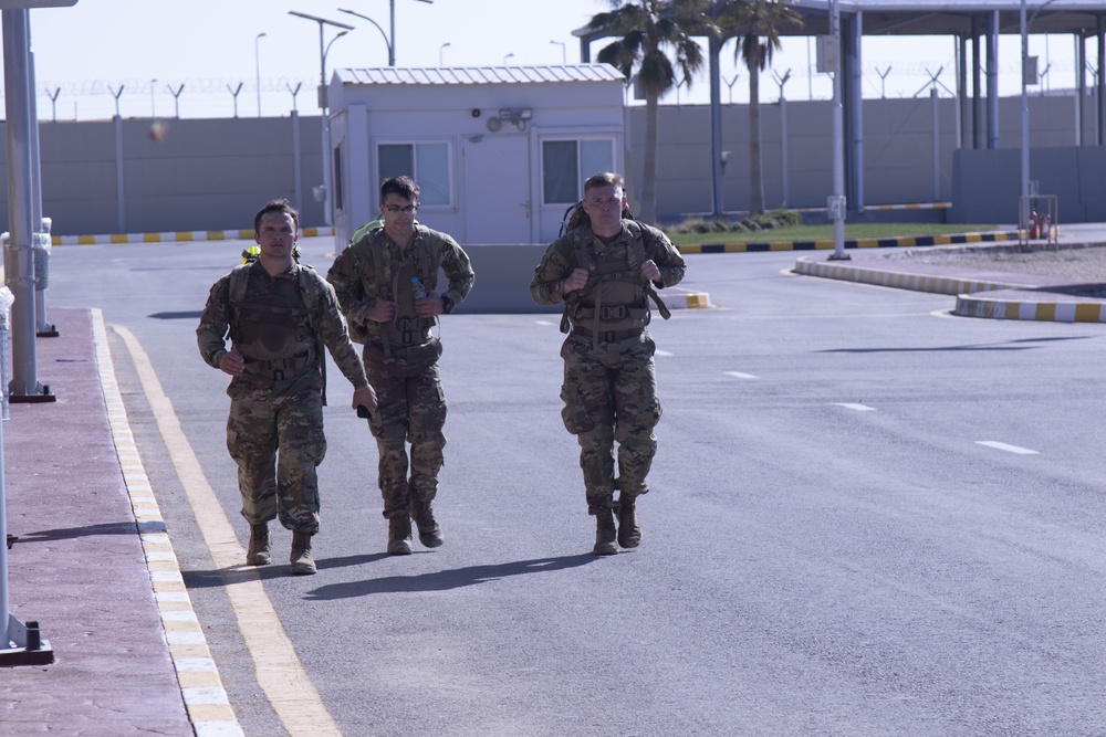 Three Soldiers from the 143rd Regional Support Group pacing each other for the Norwegian Foot March