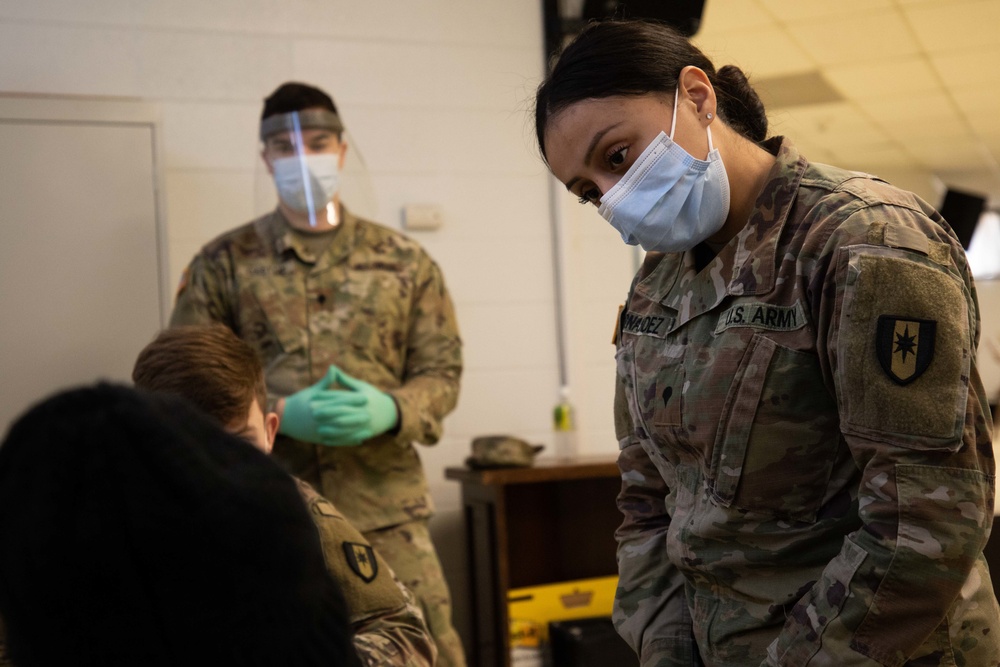 Service members support the Calvary Baptist Church COVID-19 Community Vaccination Center