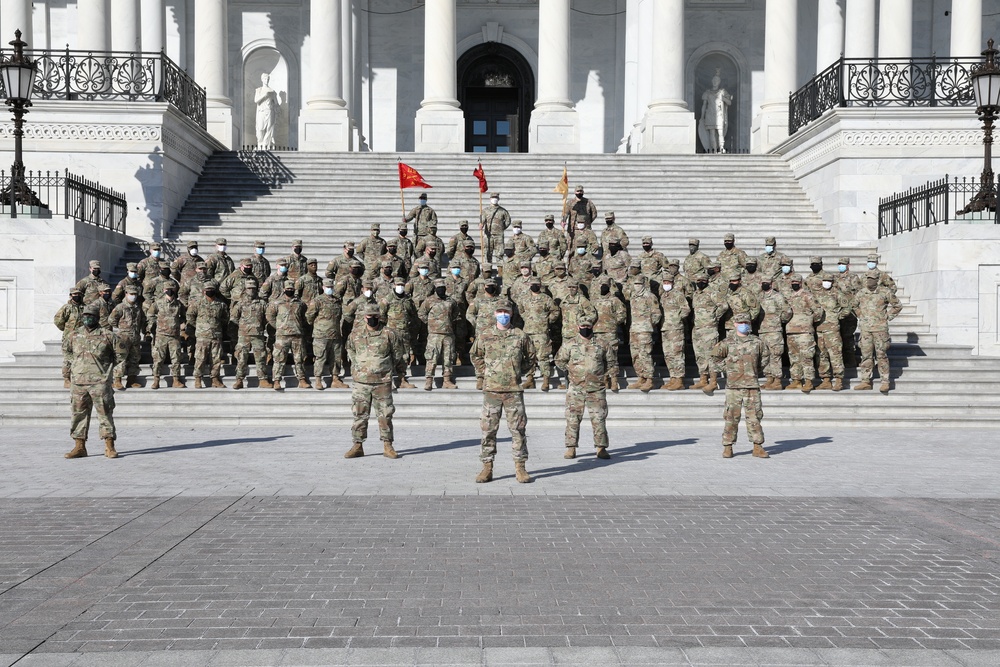 New Jersey National Guard soldiers take photo in front of Capitol steps