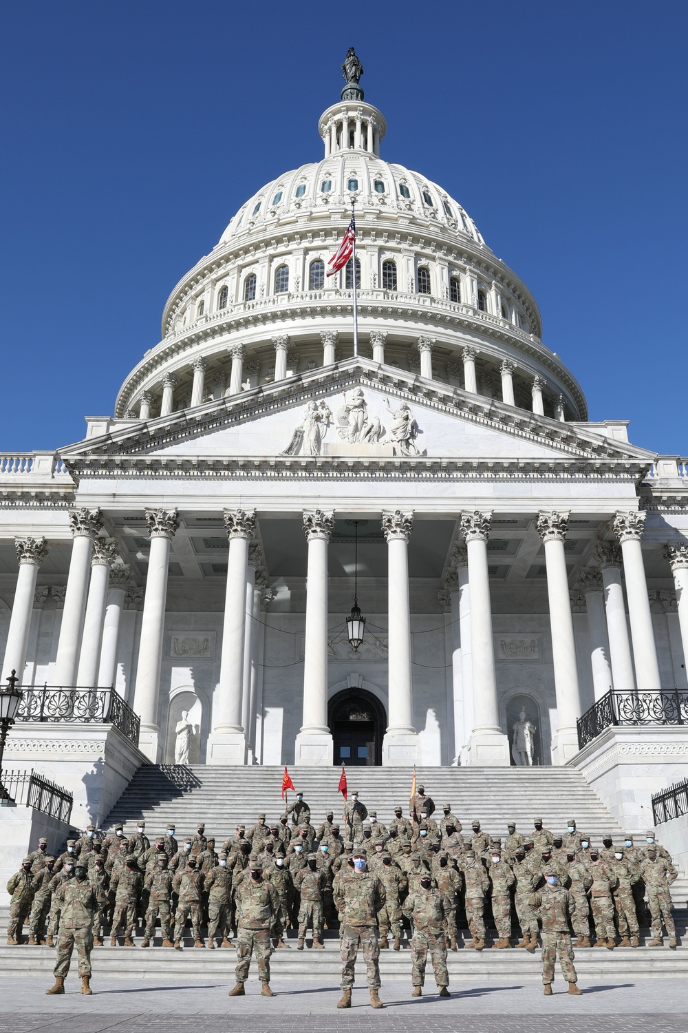 New Jersey National Guard soldiers take photo in front of Capitol steps