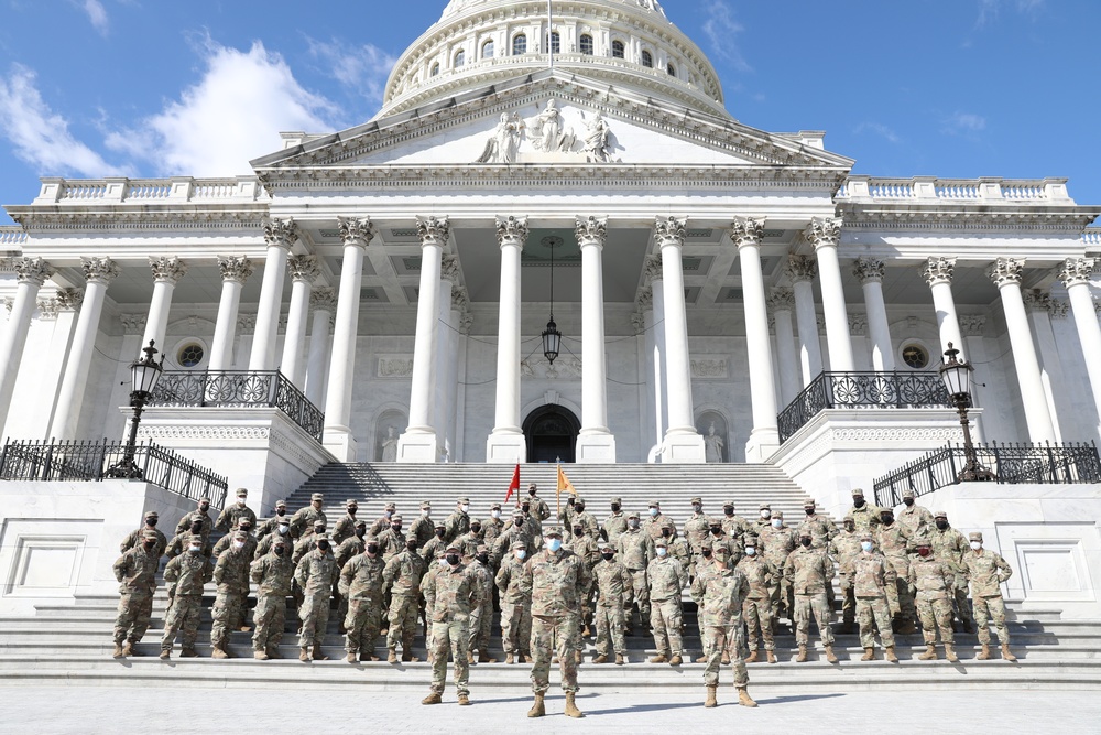 New Jersey National Guard soldiers take photo in front of Capitol steps