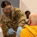 U.S. Army Soldiers inoculate community members before relocating to a new CVC in NJ
