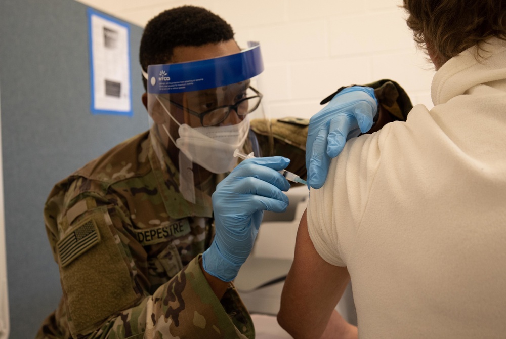 U.S. Army Soldiers inoculate community members before relocating to a new CVC in NJ