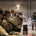 Commanding General Task Force Northeast speaks to Soldiers during a welcome brief in Chicago