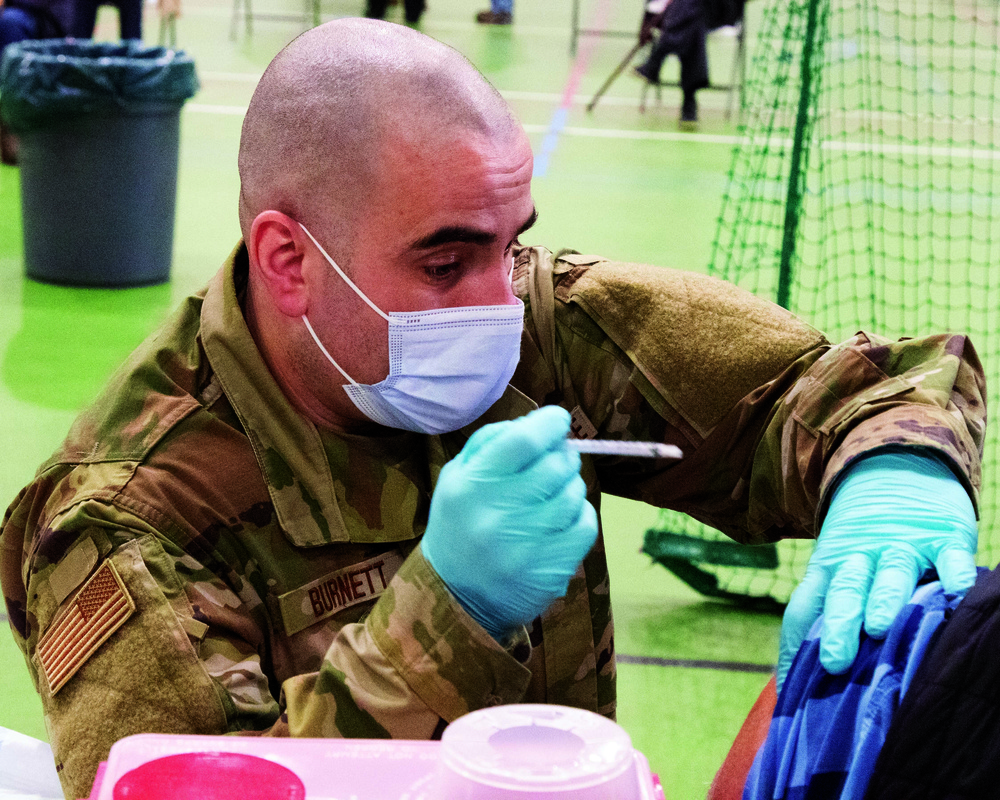 The Michigan National Guard delivers COVID-19 vaccine to YMCA