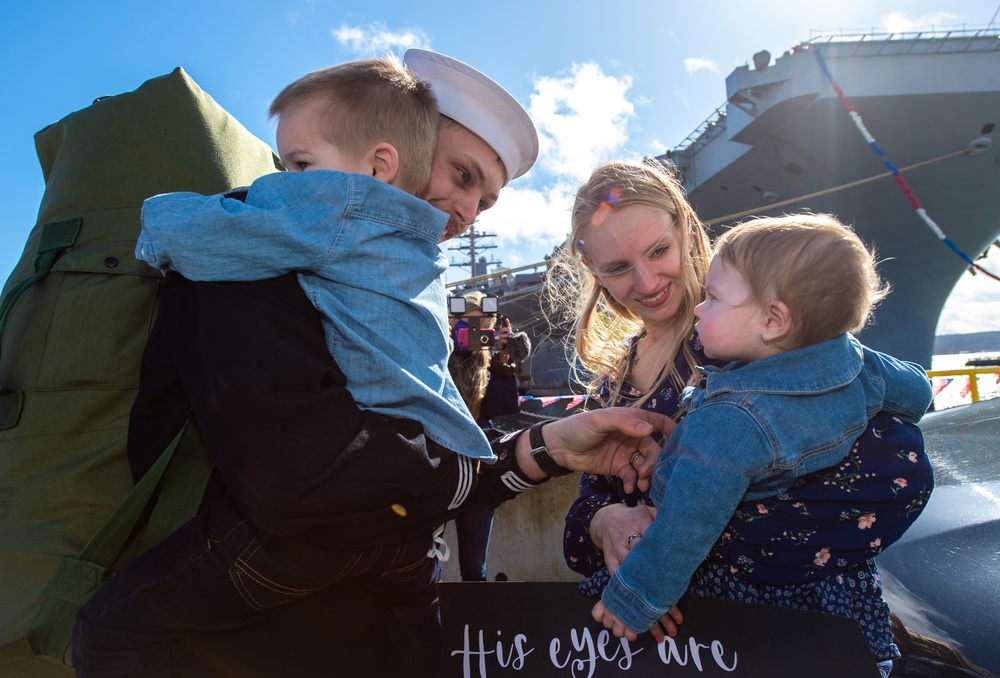 Nimitz Sailor Greets Family before Traditional First Kiss