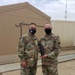 Brigadier General Tina B. Boyd, the G6 of U.S. Army Central awards the Theater Engineer Brigade's Master Sergeant Brad Shaffer with her coin for his hard work in helping establish USARCENT's Signal University.