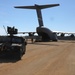 Humvee drives away from Air Force transport plane at Joint Readiness Training Center's Rotation 21-05
