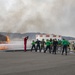 U.S. Navy Sailors with Fleet Logistics Support Squadron (VRC) 30, DET-5, Carrier Air Wing Five (CVW-5) conduct an airfield firefighting exercise