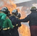 U.S. Navy Sailors with Fleet Logistics Support Squadron (VRC) 30, DET-5, Carrier Air Wing Five (CVW-5) conduct an airfield firefighting exercise