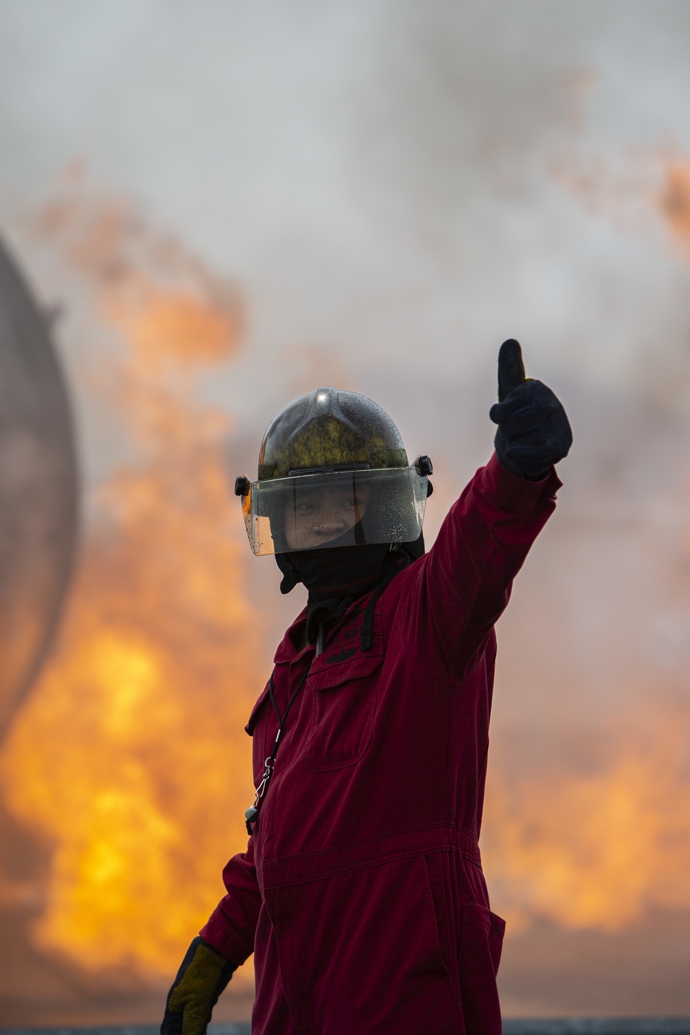 U.S. Navy Sailors with Fleet Logistics Support Squadron (VRC) 30, DET-5, Carrier Air Wing Five (CVW-5) conduct an airfield firefighting exercise