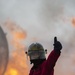 U.S. Navy Sailors with Fleet Logistics Support Squadron (VRC) 30, DET-5, Carrier Air Wing Five (CVW-5) conduct an airfield firefighting exercise