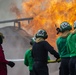 U.S. Navy Sailors with Fleet Logistics Support Squadron (VRC) 30, DET-5, Carrier Air Wing Five (CVW-5) conduct an airfield firefighting exercise
