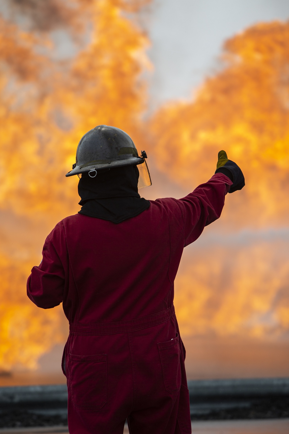 U.S. Navy Sailors with Fleet Logistics Support Squadron (VRC) 30, DET-5, Carrier Air Wing Five (CVW-5) conduct an airfield firefighting exercise