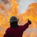 U.S. Navy Sailors with Fleet Logistics Support Squadron (VRC) 30, DET-5, Carrier Air Wing Five (CVW-5) conduct an airfield firefighting exercise