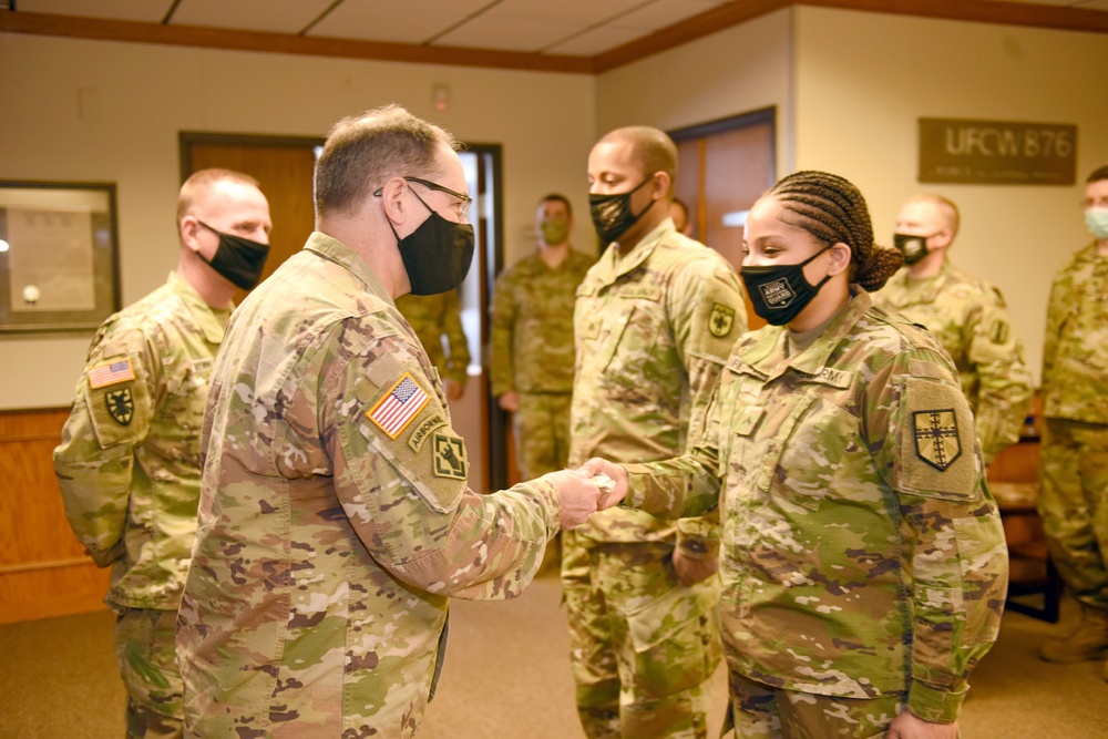 U.S. Army Major General Paul D. Rogers, adjutant general of the Michigan Presents Challenge Coin