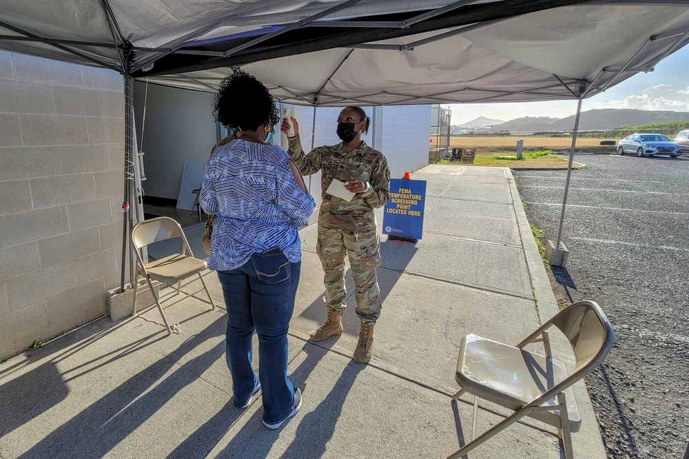 Medical professionals make final preparations before opening the COVID-19 community vaccination center in U.S. Virgin Islands