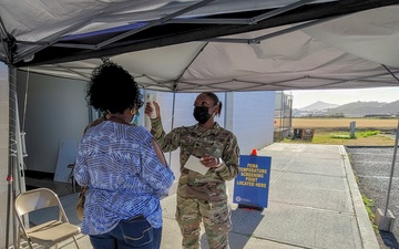 Medical professionals make final preparations before opening the COVID-19 community vaccination center in U.S. Virgin Islands