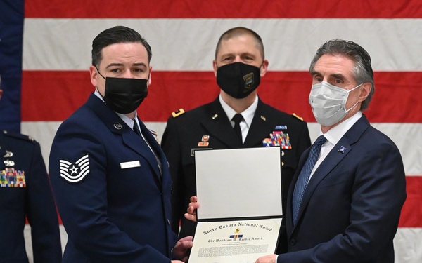 Tech. Sgt. Ryan Fontaine receives the Woody Keeble Award