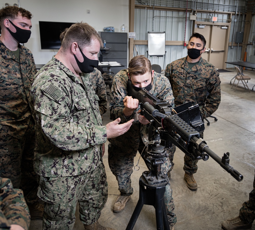 Marines receive Crew Served Weapons training from Maritime Expeditionary Security Group (MESG) 1 Training Evaluation Unit