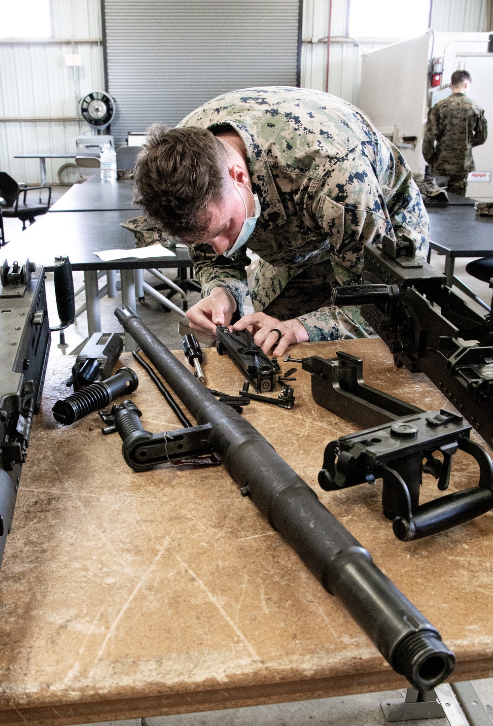 Marines receive Crew Served Weapons training from Maritime Expeditionary Security Group (MESG) 1 Training Evaluation Unit